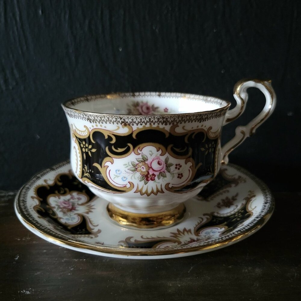 Vtg Paragon By Appointment To Her Majesty Tea Cup & Saucer Black Gold & Floral